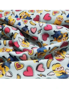 Tissu, Jersey de Coton Imprimé Minions, Minions et Cœurs, Laize 150 cm, Coton Stretch Oeko-Tex 2